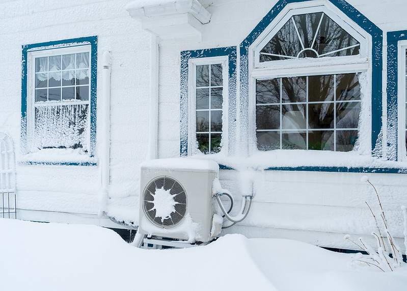 S6D1_Heat pump outside a residential home in winter.