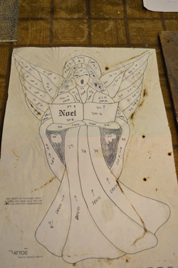 Angel, before stained glass