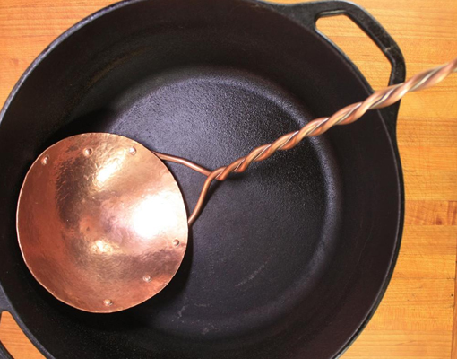 A handcrafted copper serving piece by Kingfisher.