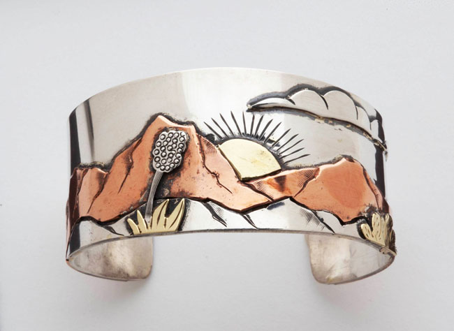 Sterling silver bracelet with copper and yellow brass, West Texas mountain scene made for the wife of a good Texas boy who moved way up north.