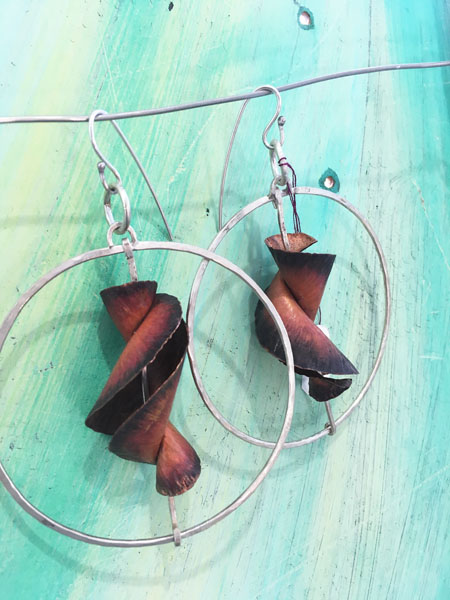 Fold formed copper earrings by Vera Johnson. 
