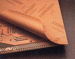Special paper protects copper-etched circuit board.