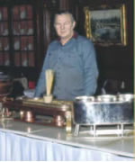 Coppersmith Hans Brueckl with some of the copper pieces he creates and repairs for The Manor Restaurant