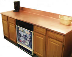 Kitchens can be enhanced with copper countertops from Frigo Design.
